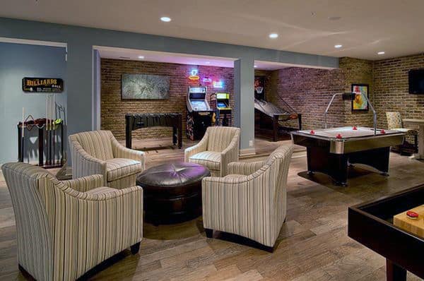 basement game room with billiards, arcade games, and lounge area